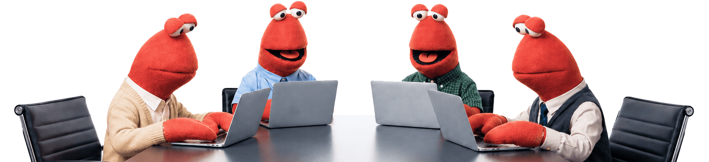 Four Claws working together at a shared desk