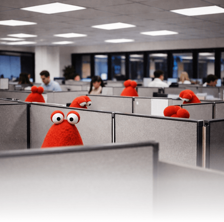 WorkClaw mascots working alongside people in an office